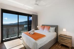Ein Bett oder Betten in einem Zimmer der Unterkunft Elementa Whitsundays