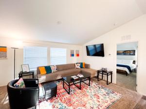 a living room with a couch and a table at Ridgeview Oasis in Poway