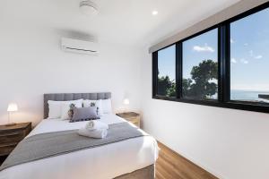Ein Bett oder Betten in einem Zimmer der Unterkunft Elementa Whitsundays