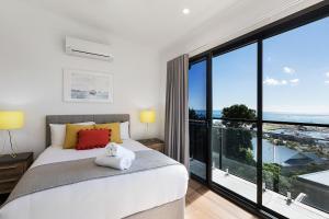 Ein Bett oder Betten in einem Zimmer der Unterkunft Elementa Whitsundays