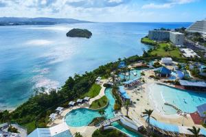 an aerial view of a resort and the ocean at Hoshino Resorts RISONARE Guam in Tamuning