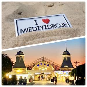 a sign that says i melbourneride in front of a building at Horyzont 801 Międzyzdroje - Ferienwohnung Misdroy in Międzyzdroje