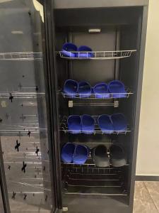 an empty refrigerator with blue seats in it at Hangzhou inn Time Youth Hostel in Hangzhou