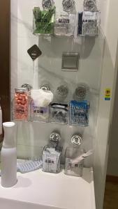 a white refrigerator with food items on a table at Hangzhou inn Time Youth Hostel in Hangzhou