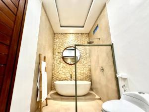 Een badkamer bij Villa Cakta