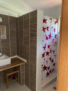 a bathroom with a sink and a shower curtain at Apartments Lili in Baška +36 photos