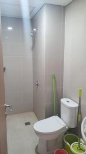 a bathroom with a toilet and a sink at Prestige Living at B Residence BSD in Serpong +8 photos