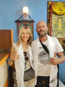 a man and a woman giving thumbs up at STUPA VIEW INN in Kathmandu