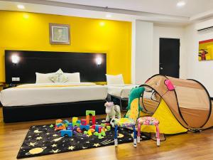 Postel nebo postele na pokoji v ubytování Hotel Sentral Riverview Melaka