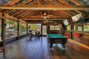 a large room with a pool table in it at Seaside Oasis 52 in Fort Myers