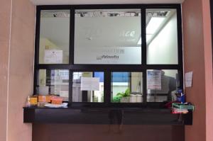 a window in a building with a sign on it at jw place รามคำแหง 40 in Bangkok
