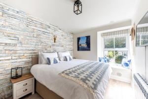 Ένα ή περισσότερα κρεβάτια σε δωμάτιο στο Beachspoke Loft