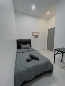 Postel nebo postele na pokoji v ubytování Elonna Homestay