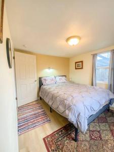 a bedroom with a bed and a window at 2 bed 1 bath cottage home in Price