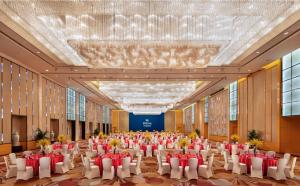 a large banquet hall with tables and chairs at Hilton Guangzhou Baiyun - Canton Fair Free Shuttle Bus, 3km to Yuexiu District in Guangzhou