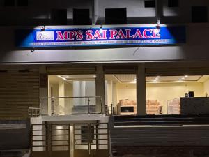 a msg salt palace sign on a building at night at MPS Sai Palace in Tiruvannāmalai