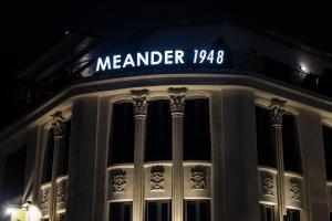 a building with a sign that reads meander at Meander 1948 in Taipei