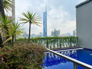 a view of the burj khalifa from a balcony of a hotel with at 3min to Pavilion & MRT [1-6Pax] View Menara 118 by MOJI HOME in Kuala Lumpur