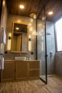 a bathroom with a sink and a shower at Midgard house in Dalung