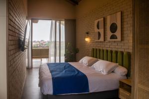 a bedroom with a bed and a large window at Midgard house in Dalung +40 photos