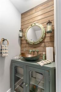 a bathroom with a sink and a mirror at 114 Austin Ave, Unit 11 in Wildwood