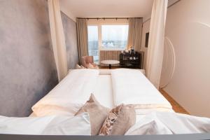 Postel nebo postele na pokoji v ubytování Hotel Schachner