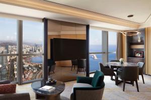 a living room with a view of the city at The St. Regis Qingdao in Qingdao