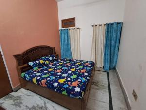 Postelja oz. postelje v sobi nastanitve Satwik Homestay