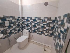 Kopalnica v nastanitvi Satwik Homestay