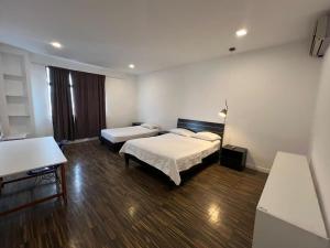 Uma cama ou camas num quarto em Perla Suites Malecón