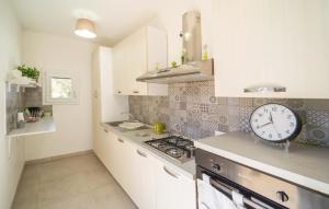 A kitchen or kitchenette at Casa Libasci