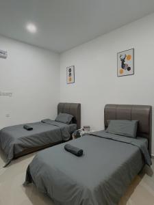 Postel nebo postele na pokoji v ubytování Elonna Homestay