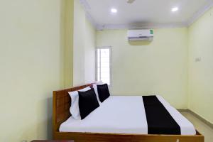 Łóżko lub łóżka w pokoju w obiekcie SPOT ON Al Nizam Guest House