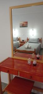 a bedroom with a bed and a mirror on a dresser at Hermes in Kavos +52 photos
