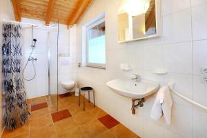 a bathroom with a sink and a shower at Terraced Houses Oliver L ngenfeld in Längenfeld
