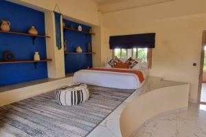 Кровать или кровати в номере Villa Kaba Resort by Pandawa