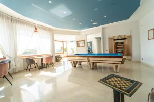 a living room with a pool table in it at Villa Tito Livio StarGuest in Pozzuoli