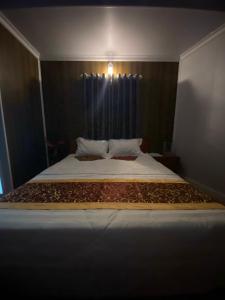 Postelja oz. postelje v sobi nastanitve Motel Nhật Quang(HẢO BÙI)