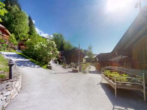 a street with a group of buildings and plants at Chalet in Neukirchen in Neukirchen am Großvenediger