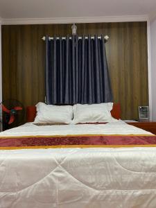 Säng eller sängar i ett rum på Motel Nhật Quang(HẢO BÙI)