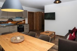 A kitchen or kitchenette at Apartment in Bramberg am Wildkogel with barbecue