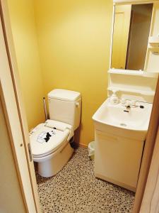 a bathroom with a toilet and a sink at Izu One Club - Vacation STAY 20411v in Futo