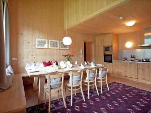 a dining room with a long table and chairs at Apartment in Ramsau im Zillertal with sauna in Ramsau im Zillertal