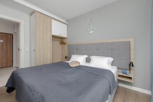 Posteľ alebo postele v izbe v ubytovaní Perfect Holiday Apartments Bel Mare by Noclegi Renters
