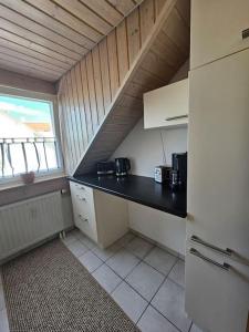 a kitchen with a black counter top in a room at 2 Zimmer Wohnung in Bad Waldsee in Bad Waldsee