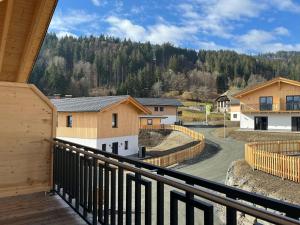 a balcony with a view of a town at Chalet near Nassfeld ski resort in Carinthia in Hermagor