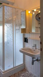 a bathroom with a shower and a sink at Villa Gasparina in Ronchi