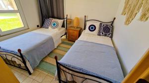 Postel nebo postele na pokoji v ubytování Grapevines Villas Makrygialos