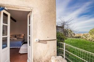 Postel nebo postele na pokoji v ubytování Casale Marciana Marina