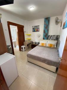 a bedroom with a large bed in a room at Marina's Rooms in Larnaca